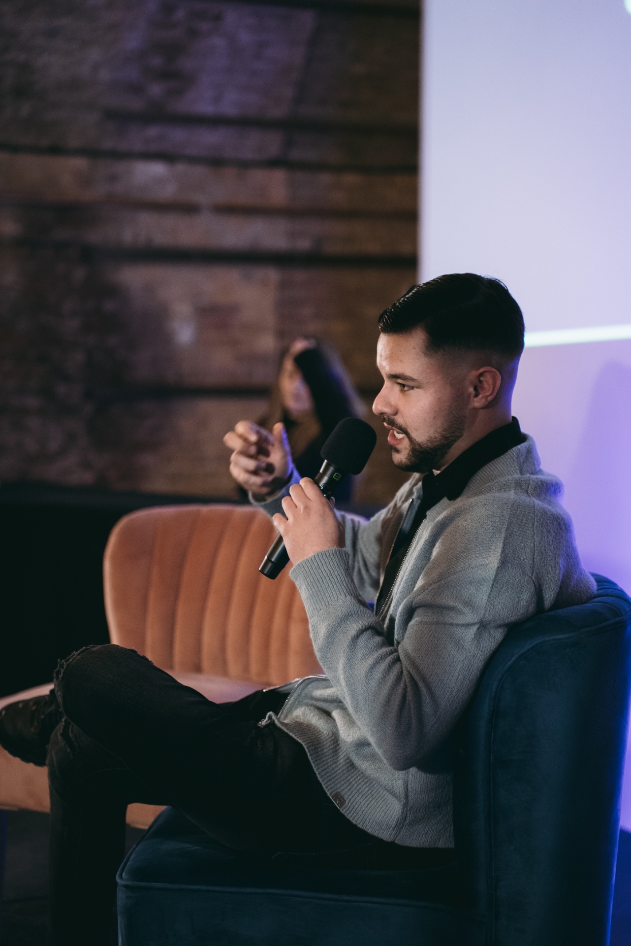 Founder speaking on stage at a TikMarketing event